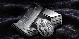 Silver coins and bars being stacked